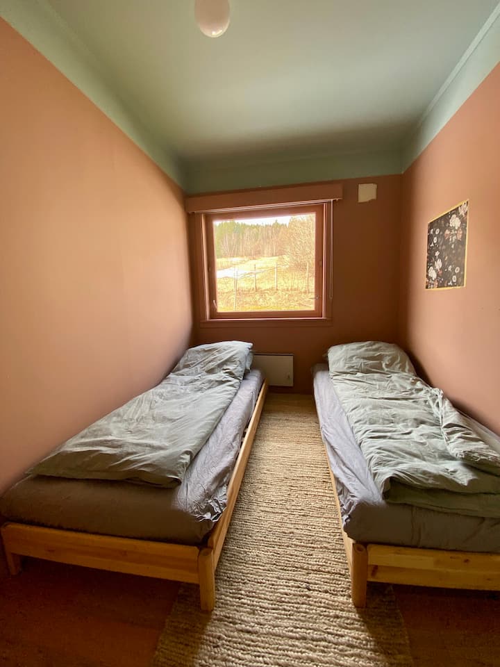 Bedroom 2 with two single beds that can be combined to form a double bed. If sleeping only one person the classic Utåker bed can be stacked on top of one another to give a higher bed and more free space in the room