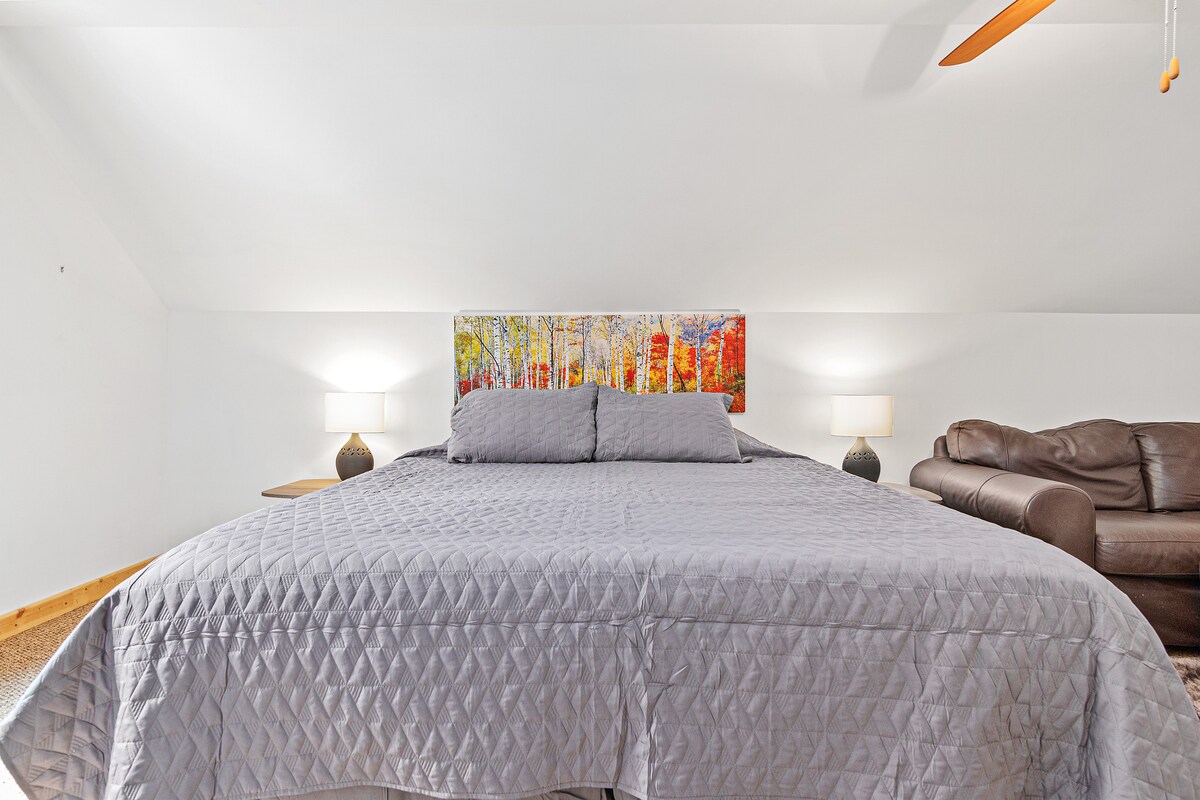 Enjoy a private stay in a king sized bed in the bunkhouse above the garage!  Space includes bed, couch, full body mirror, and 50 inch Smart TV