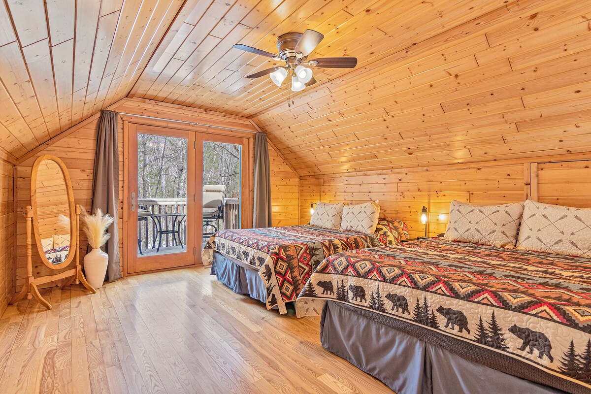 Open Loft with 2 queen beds and private balcony.
