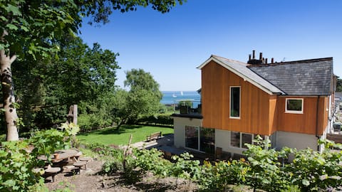 Stunning house with sea views and private woodland
