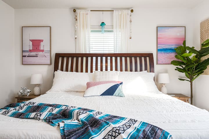 Second bedroom on the main level with king bed and ensuite full bath. Shower in ensuite bath is shared with bunk room. 