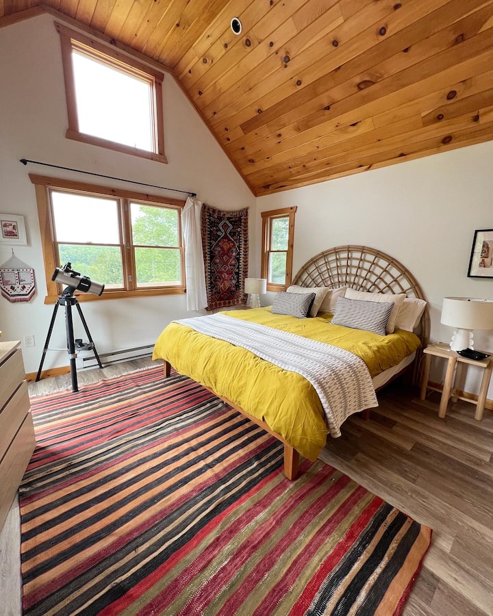 This is master bedroom number one. Each of the upstairs rooms have a king size bed, ample pillows, side tables and lamps, dresser and closet. In addition they have their own private terraces with seating to enjoy the views.