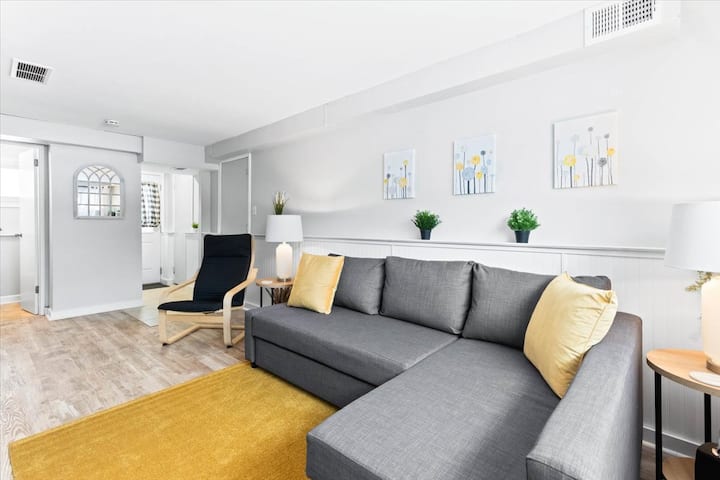 Family room with access to backyard, laundry room, and half bath.