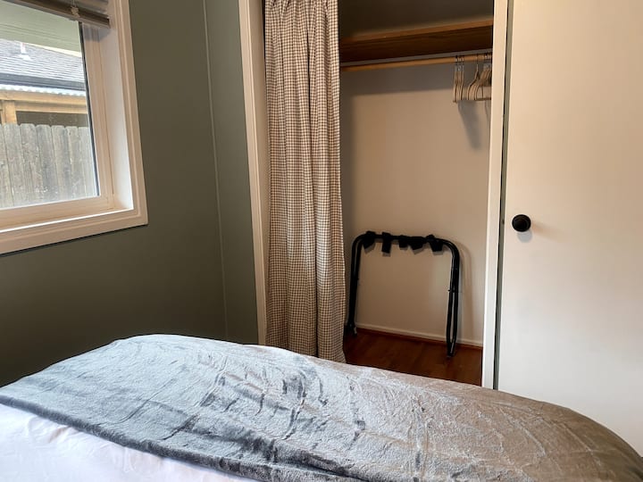 Bedroom #2 - Full bed and fun pops of color (games in the closet).