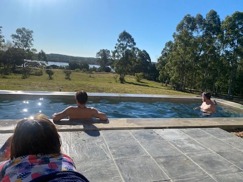 A FIVE-BEDROOM HOUSE WITH A BEAUTIFUL POOL OVERLOOKING THE RIVER