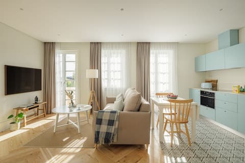 Apartment with balcony, view and pellet stove