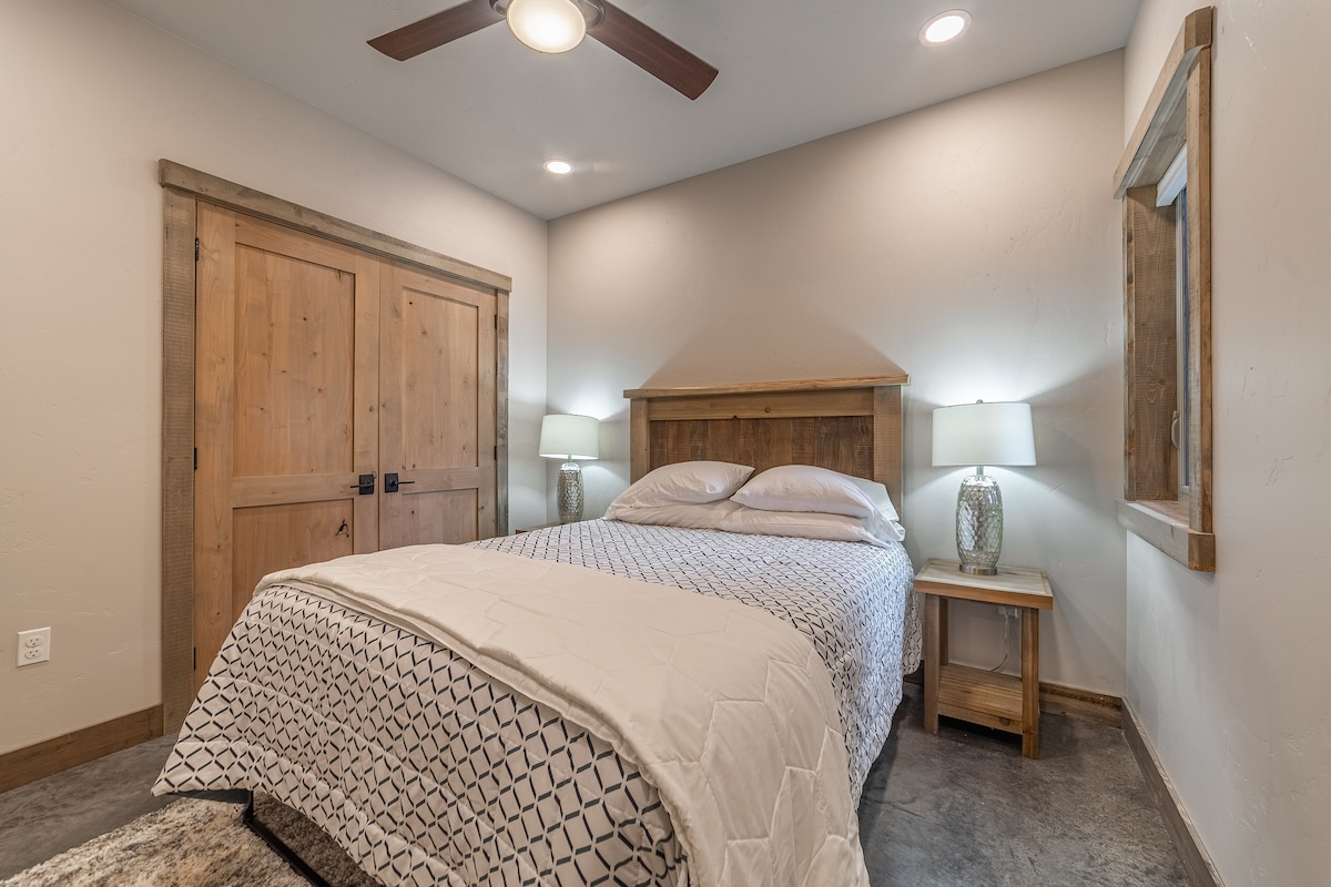 Main floor Queen bed. Bedroom also has a closet.