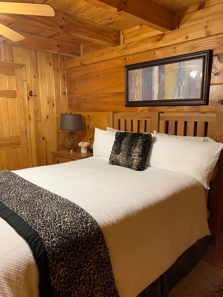 Guest Bed Room with queen bed and private full bath with soaking tub and shower.