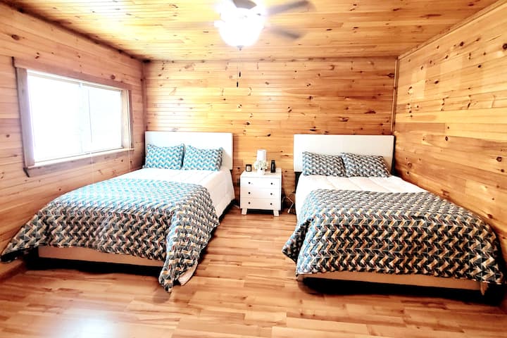 Upstairs guest bedroom with 2 full beds & private bath.
