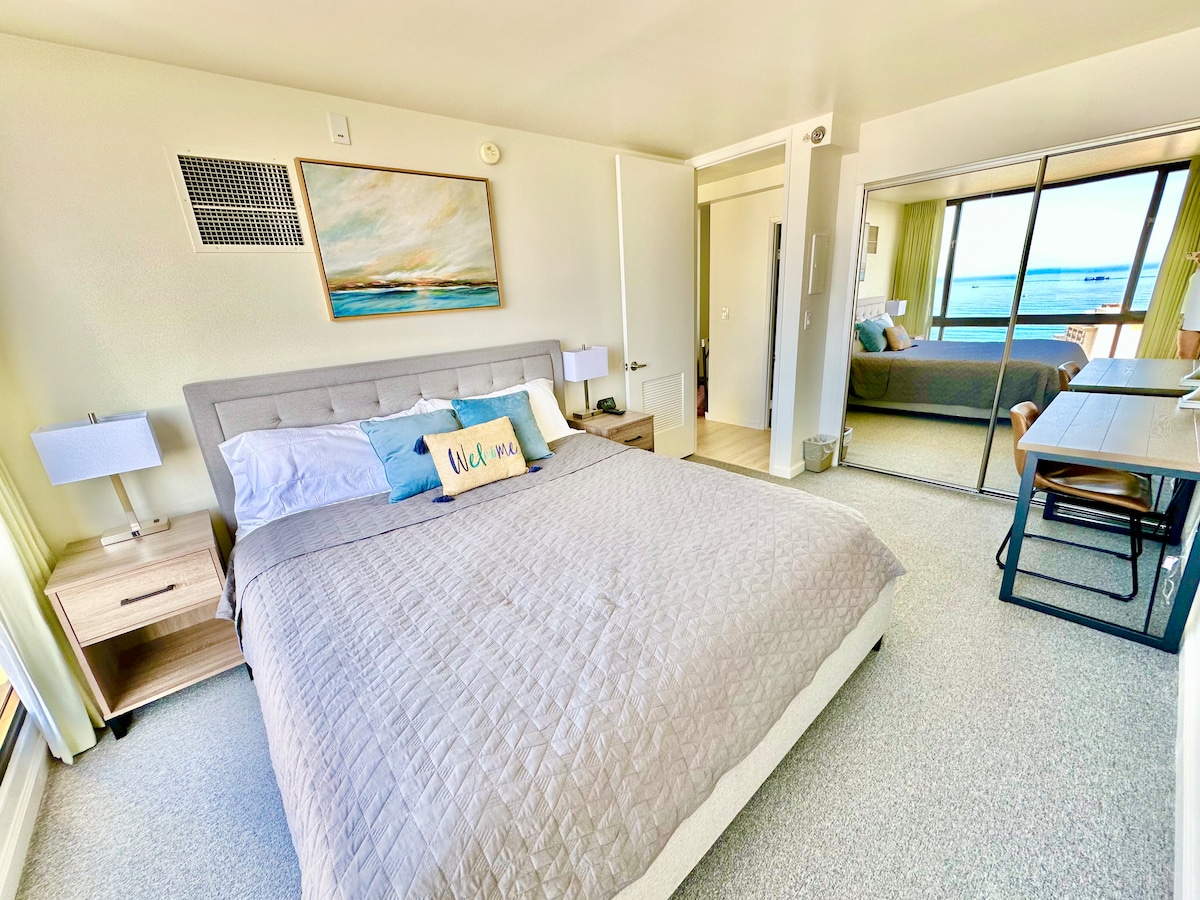 King size bed in the bedroom with full length closet door mirror.