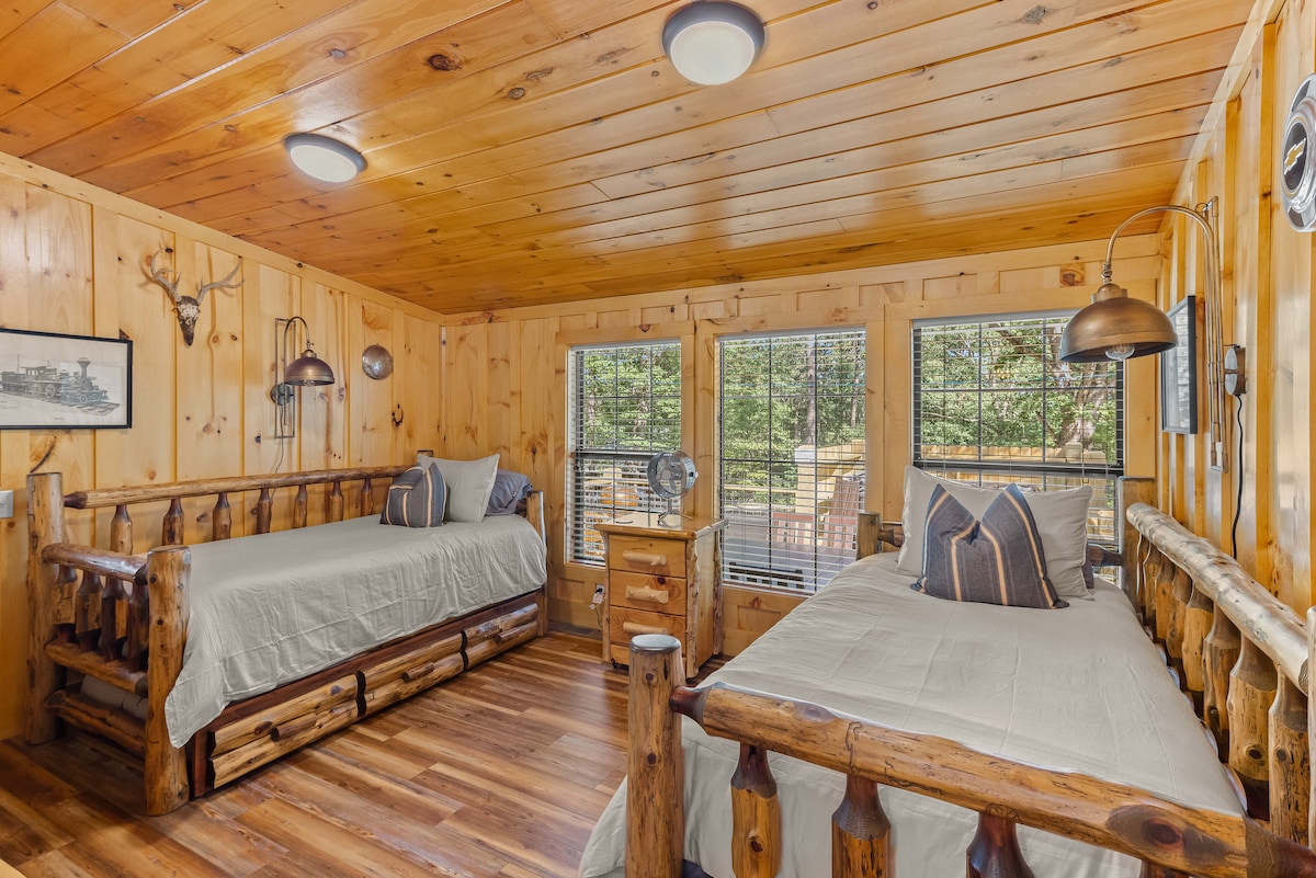 Twin trundle beds with rolling log side table