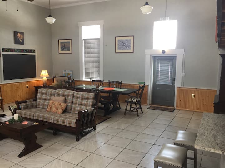 The dining area has ample seating for guests with full kitchen and island for serving food. Harvest table can seat large groups with extra Leafs available. Note entry door has light switch on LH side as you enter behind cover and fan remote.