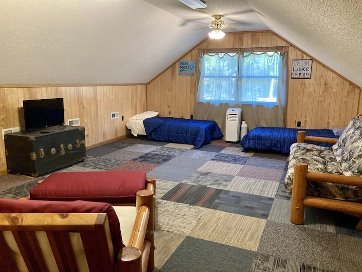 Bonus room/ bedroom has two twin beds , queen futon, twin futon, smart TV , and sink vanity right there in the room.