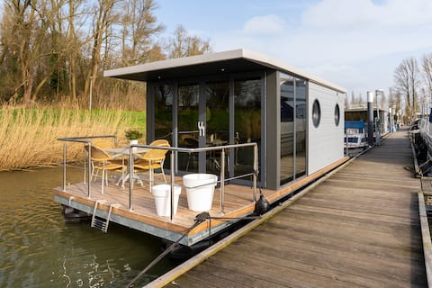 Stay in a houseboat in a port