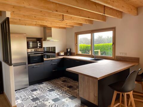 New wooden house with terrace and garden