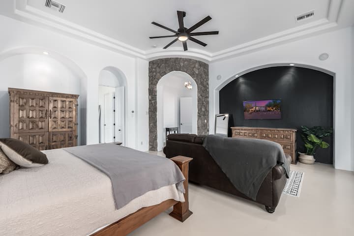 This large master bedroom has a king size bed and a pull out queen bed.  A television to catch a few shows while getting ready to snooze.