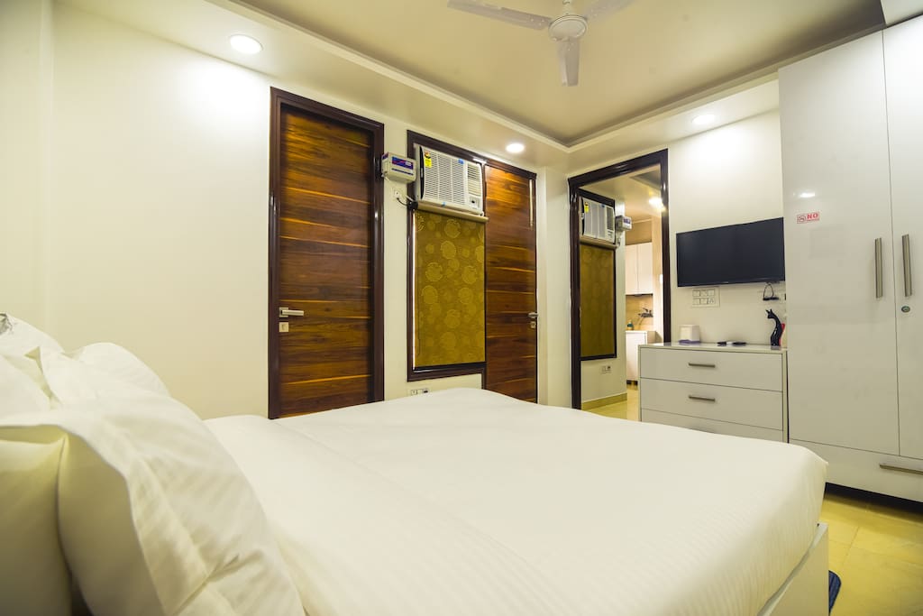 This 1 bedroom apartment has a queen bed with a beautiful private balcony and other amenities like  TVs with amazon firestick to choose any OTT Listen to the old or Latest Bollywood Songs with Clock radio etc.