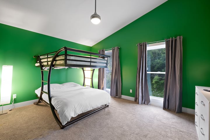 Green bedroom, two full bunk beds.