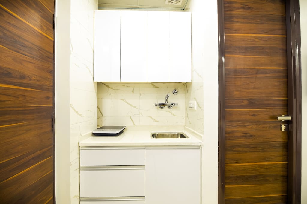 Your kitchen is fully equipped with a microwave, toaster, and tea-coffee maker. Cupboards are stocked with all cooking and serving utensils, glassware, bowls plate cups, etc