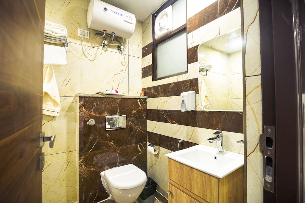 Ensuite bathroom with shower, Hot/ cold water, Fresh Towels, toilet roll, dental kit, shampoo, soap, etc.