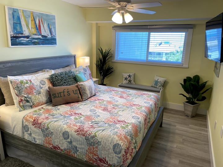 King size guest bed and room with a view.