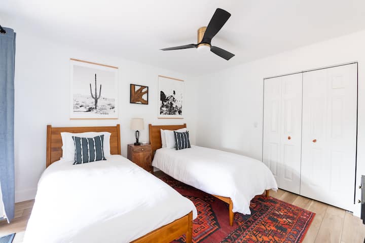 Twin bedroom with outdoor patio access