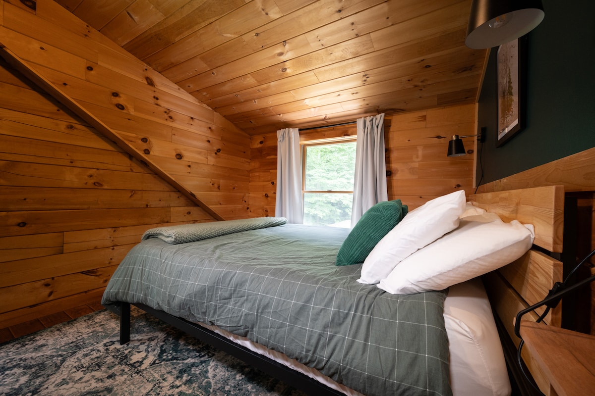 The second floor bedroom was recently updated and features a queen bed with Nectar memory foam mattress, bedside tables and lamps, and a dresser to store your belongings.