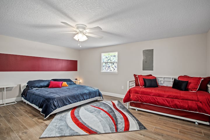 Fire room with lux king pillow top and daybed/trundle with 2 twin pillow tops. Massive closet with desk to work at if you need to get on a zoom call.