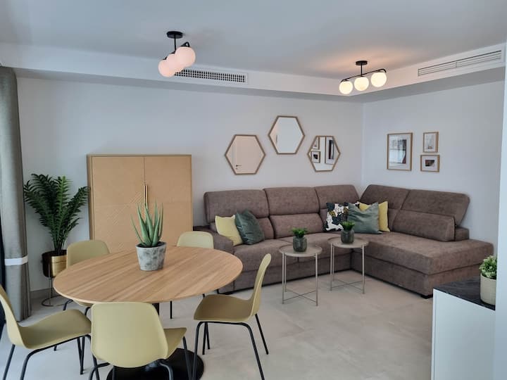 Living room with a large comfy sofabed.