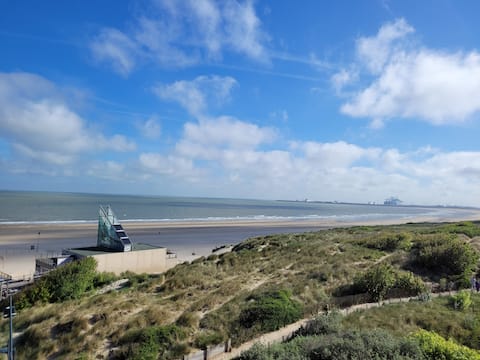 Corner apartment with sea & dune view + garage