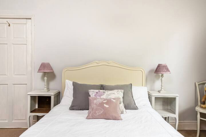 Second bedroom with plush, comfortable bed.