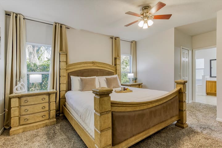 Large Master Suite, with a king size bed with new mattress by Zinus Hybrid Comfort.  Two large windows for natural daylight and TV in room. Located on first floor.
