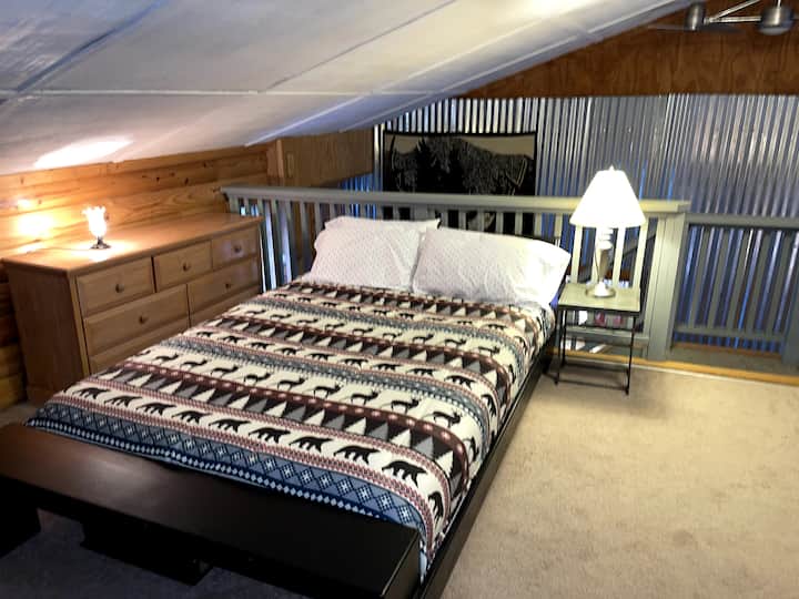 Loft Bedroom with Queen size bed and TV with access your own streaming services.