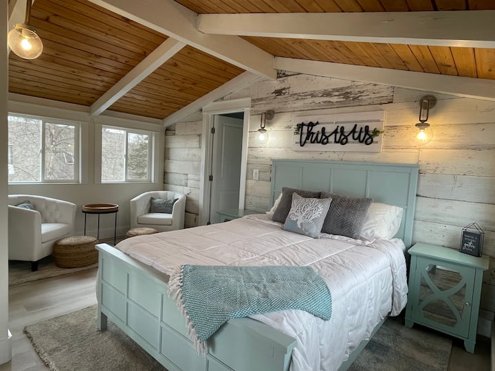 The Master Suite Loft with Queen size bed. Barnwood imported from the hills of Tennessee.  And a cozy corner for your cup of coffee or favorite book!

Blackout blinds for and sleep masks provided.  It is the land of the midnight sun, after all!
