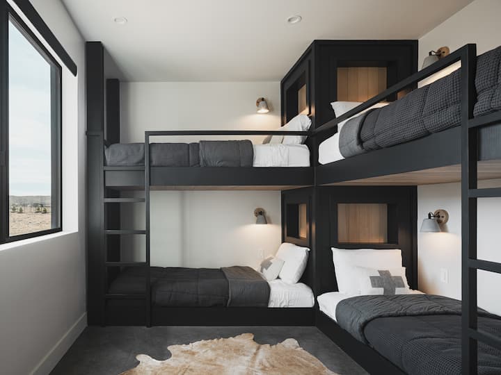 Bunk room has 4 Twin XL beds all with reading lights,  and niches with power outlets. Ceiling fan and room darkening shades. Bedroom has its own Thermostat for your specific radiant heat.