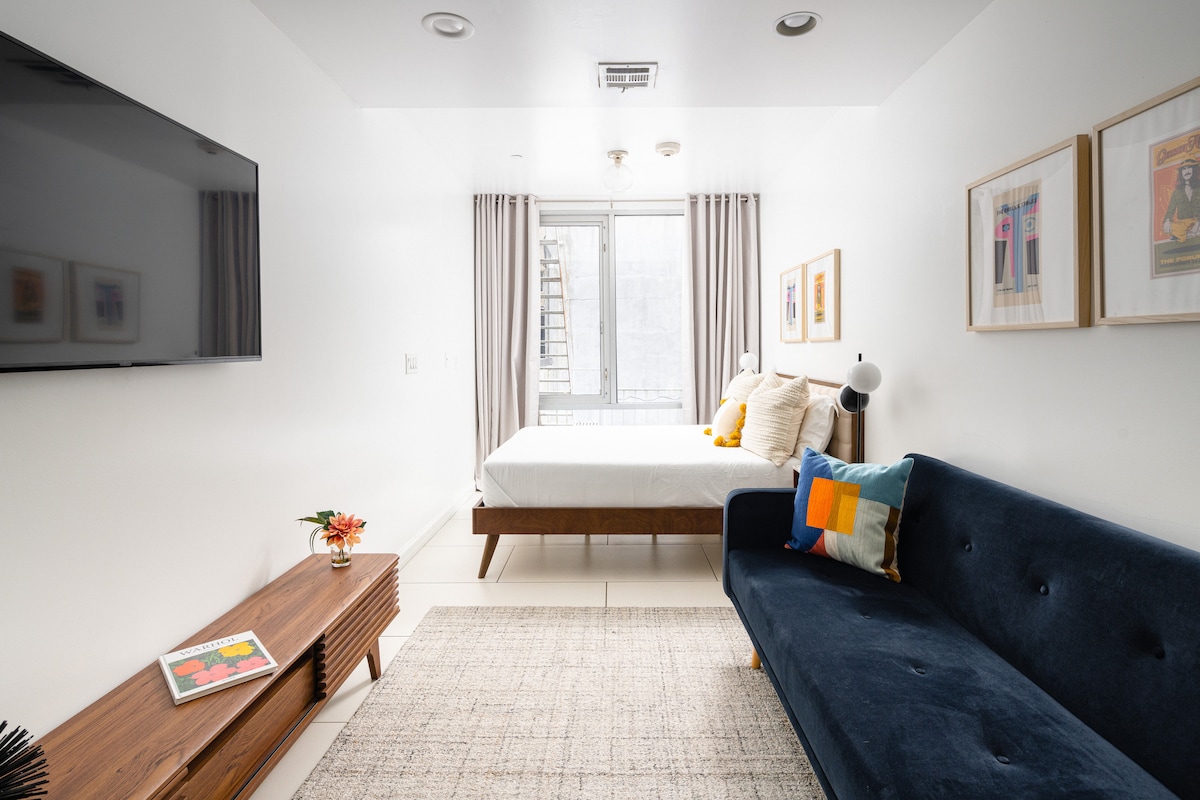 Studio view toward the queen bed and sofa bed