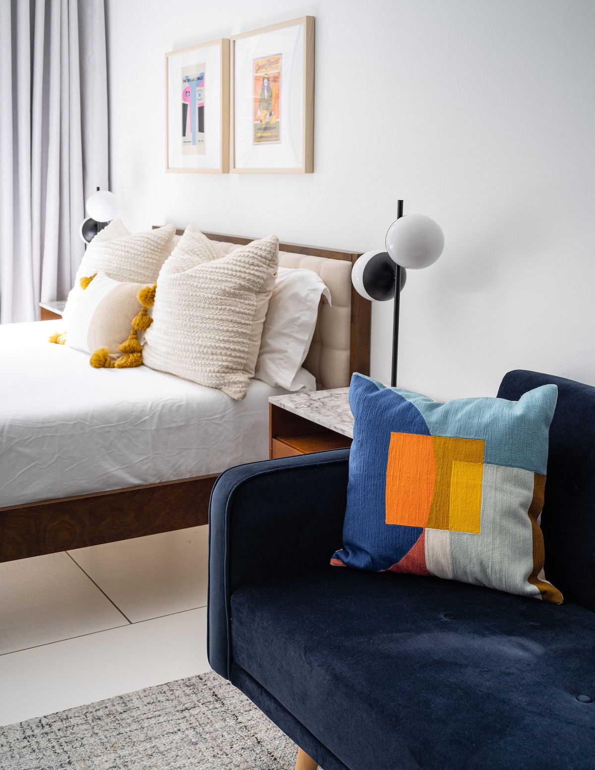 Detail of the queen bed and sofa bed within the open-plan space
