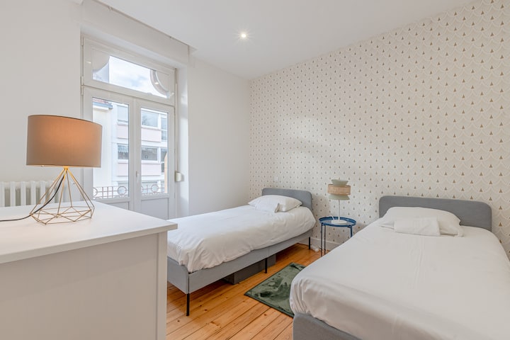 Bedroom 1, equipped with two single beds