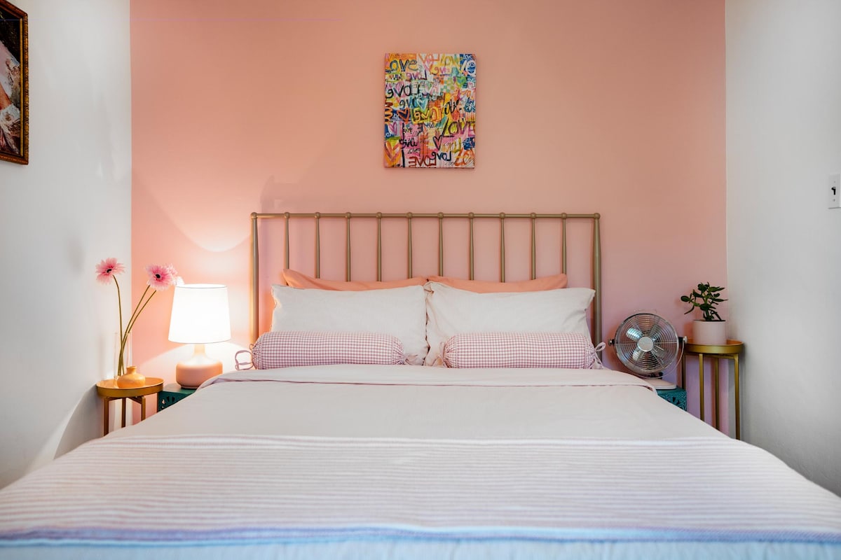 The pink room, with a medium firm memory foam queen bed.