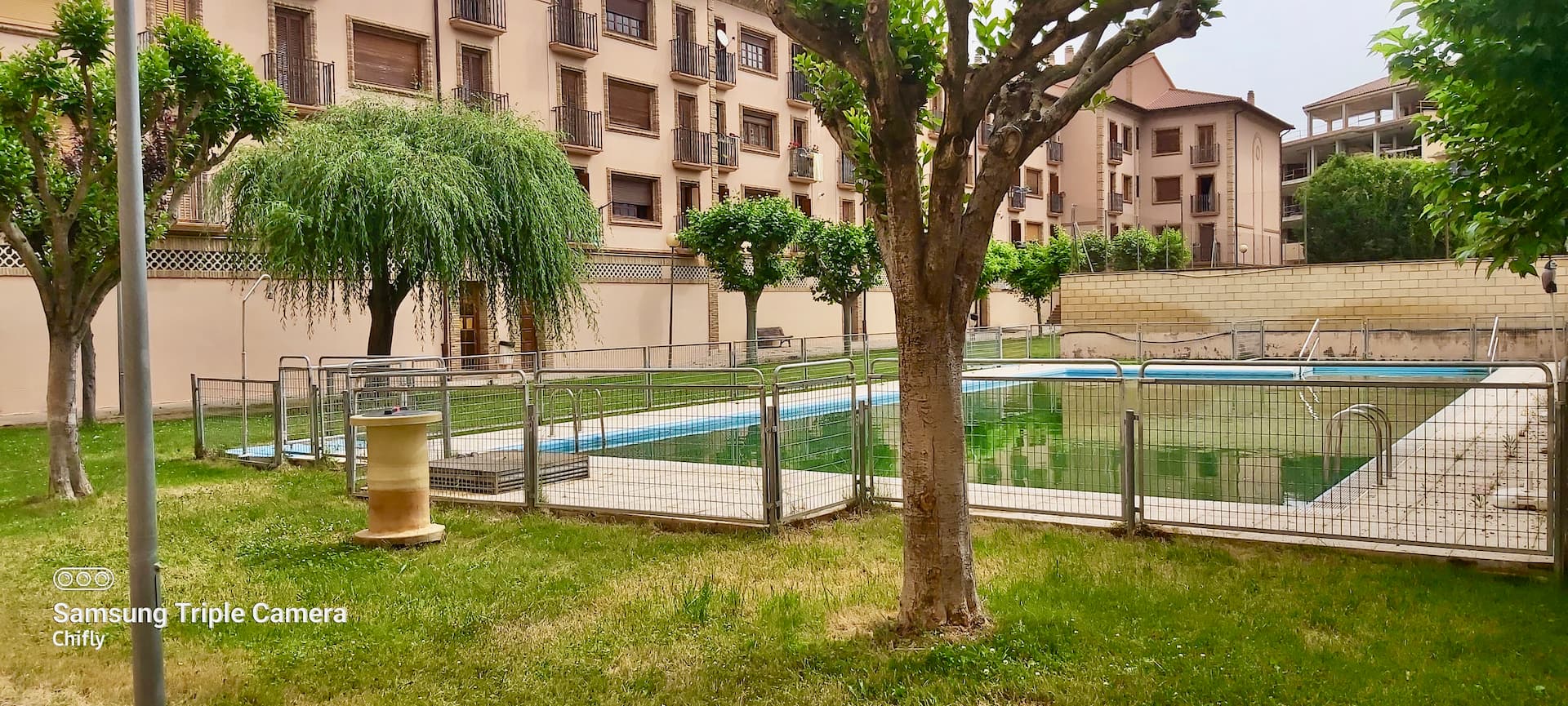 A bright apartment in a residential development with a swimming pool