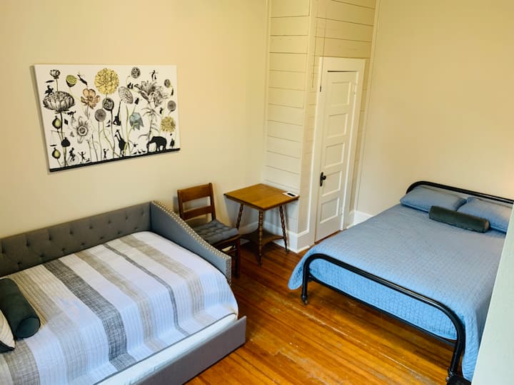 Middle bedroom features a full bed and trundle with 2 single beds.