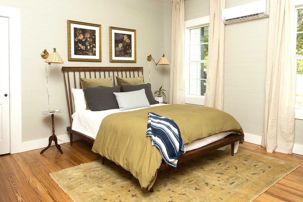 The first floor guest bedroom adjoins the airy sunroom at the front of the home and hosts a small office nook with desk and an assortment of supplies should you need to jot down notes or send out emails during your stay.