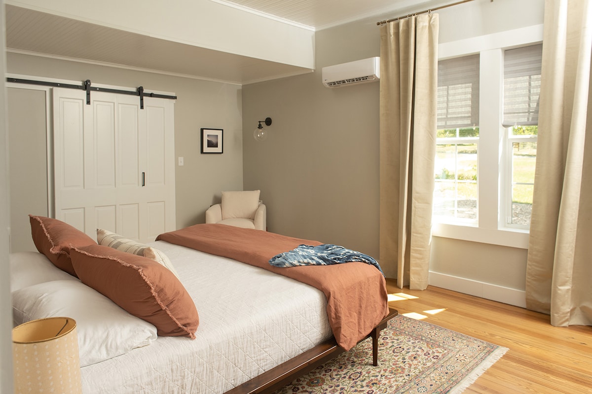 The master bedroom, with its king size bed, is situated toward the back of the house on the first floor. While the main walk-in closet will be locked guests have access to en emptied secondary closet in the room.