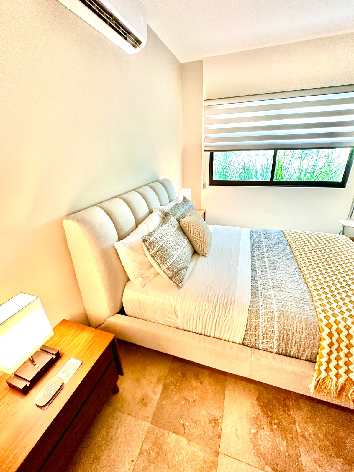 Bedroom 3 sports a queen-sized bed, plenty of light, an ensuite bathroom and closet, and USB charging on each nightstand.