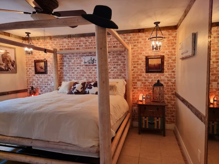 You will melt into this massive cowboy bed and admire the amazing Western furniture.