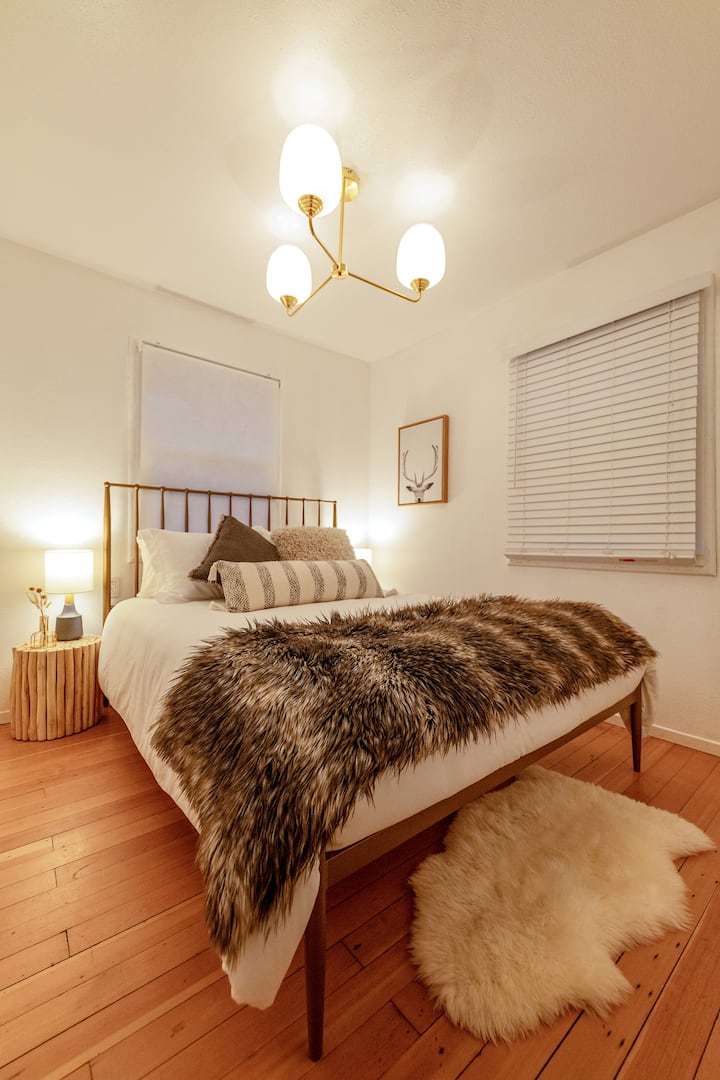 On the main floor you'll find the "wolf den" with a modern yet woodsy vibe which includes a queen size bed