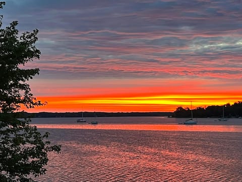 Lake front home on private, tree-lined drive.