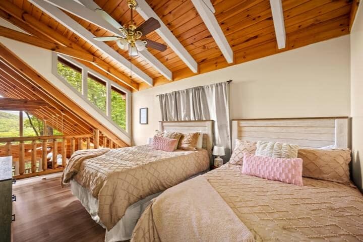Super comfy queen and full size beds in the open loft bedroom upstairs...
