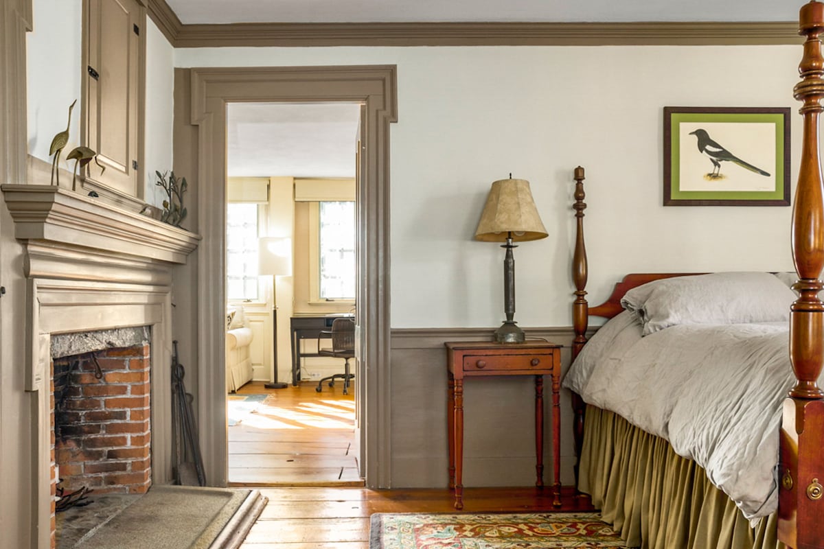 Second bedroom with closet, desk, and chaise longue. 