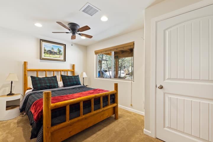 Queen bed in guest bedroom